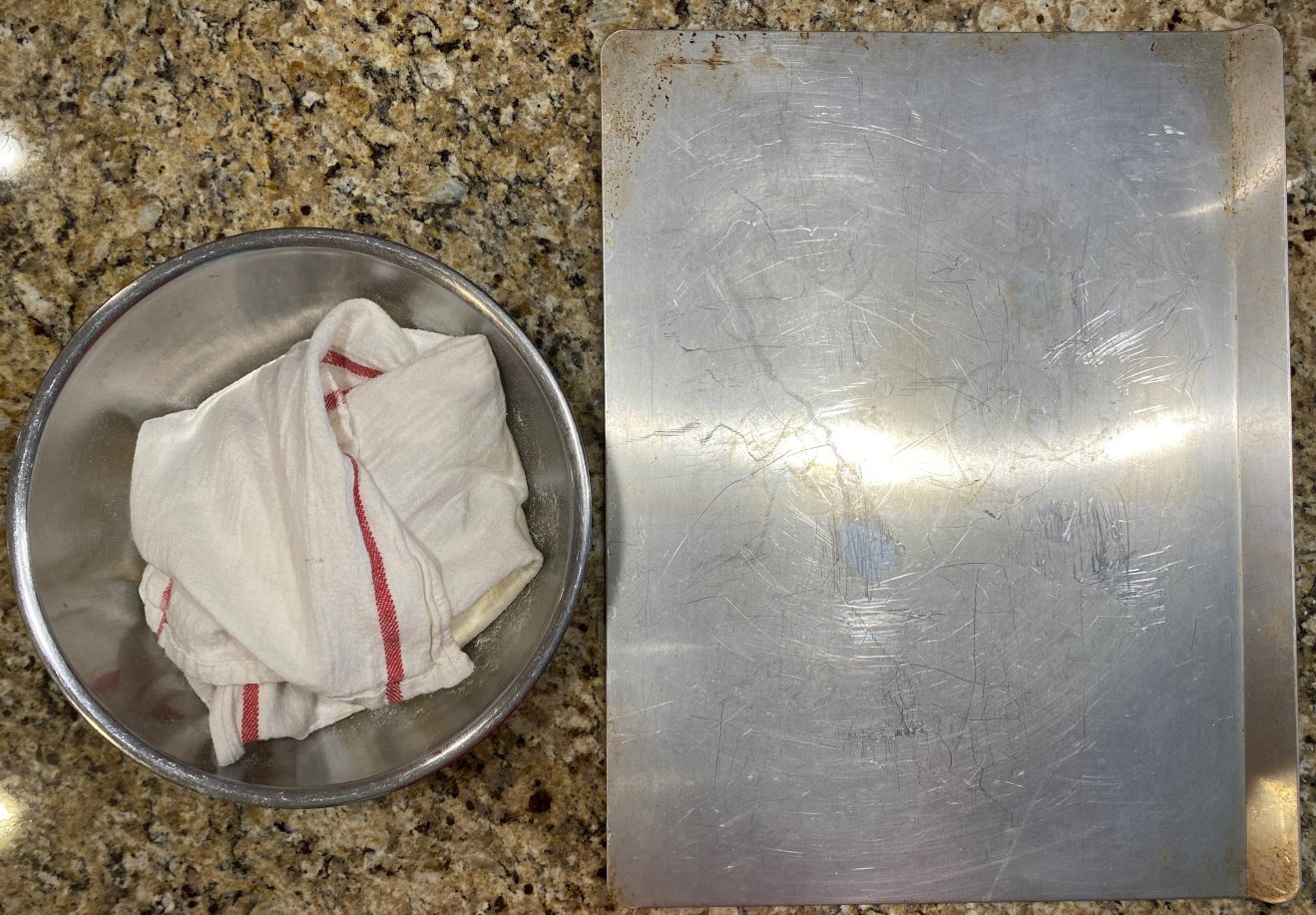 Sheet pan and dough in bowl wrapped